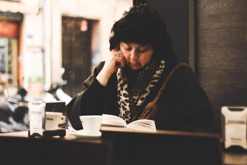 Woman reading Photo by Roman Carey