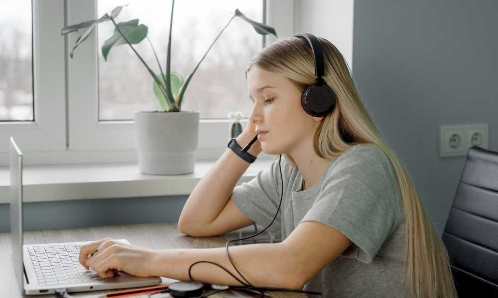 Girl studying with headphones